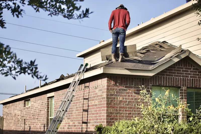 Professional roofer working on a residential roof in Blue Spring Reserve